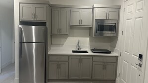 A modern kitchen with stainless steel appliances, light-colored cabinets, and a built-in microwave. - New amazing location  (Antioch)