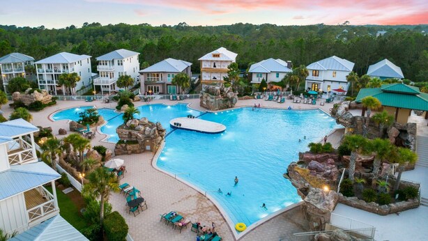 A resort with multiple swimming pools, a large central pool, and several guest buildings. - FREE Golf Cart | New home located on resort style pool | Massive Kitchen/Private Balconies/Sleeps 12 (Santa Rosa Beach)