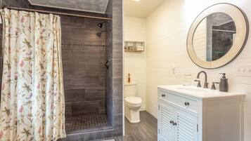 Shower, hair dryer, towels, toilet paper