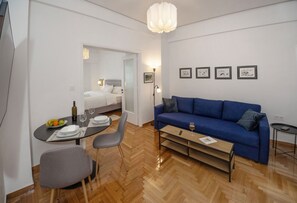 Comfort Apartment | Living area | 50-inch Smart TV with digital channels - Downtown exceptional studio Syntagma GHH (Athens)