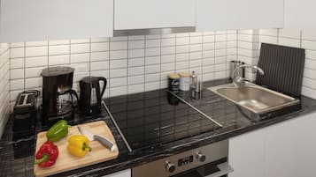 Apartamento conforto | Cozinha privada | Frigobar, fogão, cooktop, chaleira elétrica