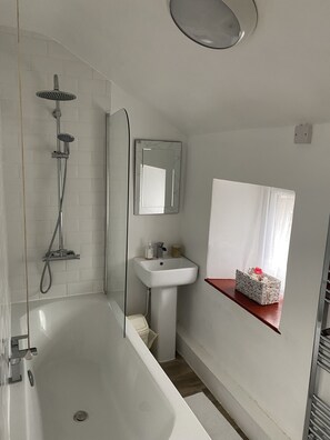 Shower, hair dryer, towels, toilet paper