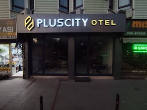 A PlusCity Hotel with a modern facade, large glass windows, and a visible entrance. - PLUSCITY HOTEL (Konya)