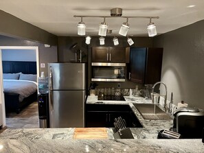 Fridge, microwave, stovetop, coffee/tea maker