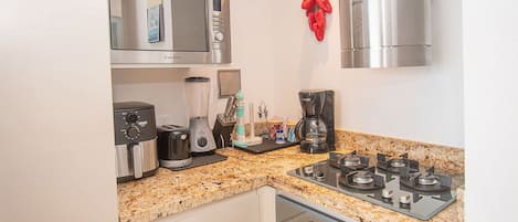Apartment (GT01J) | Private kitchen | Fridge, microwave, cookware/dishes/utensils, cleaning supplies