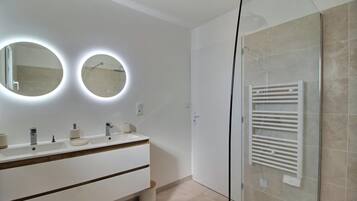 Shower, hair dryer, towels, toilet paper