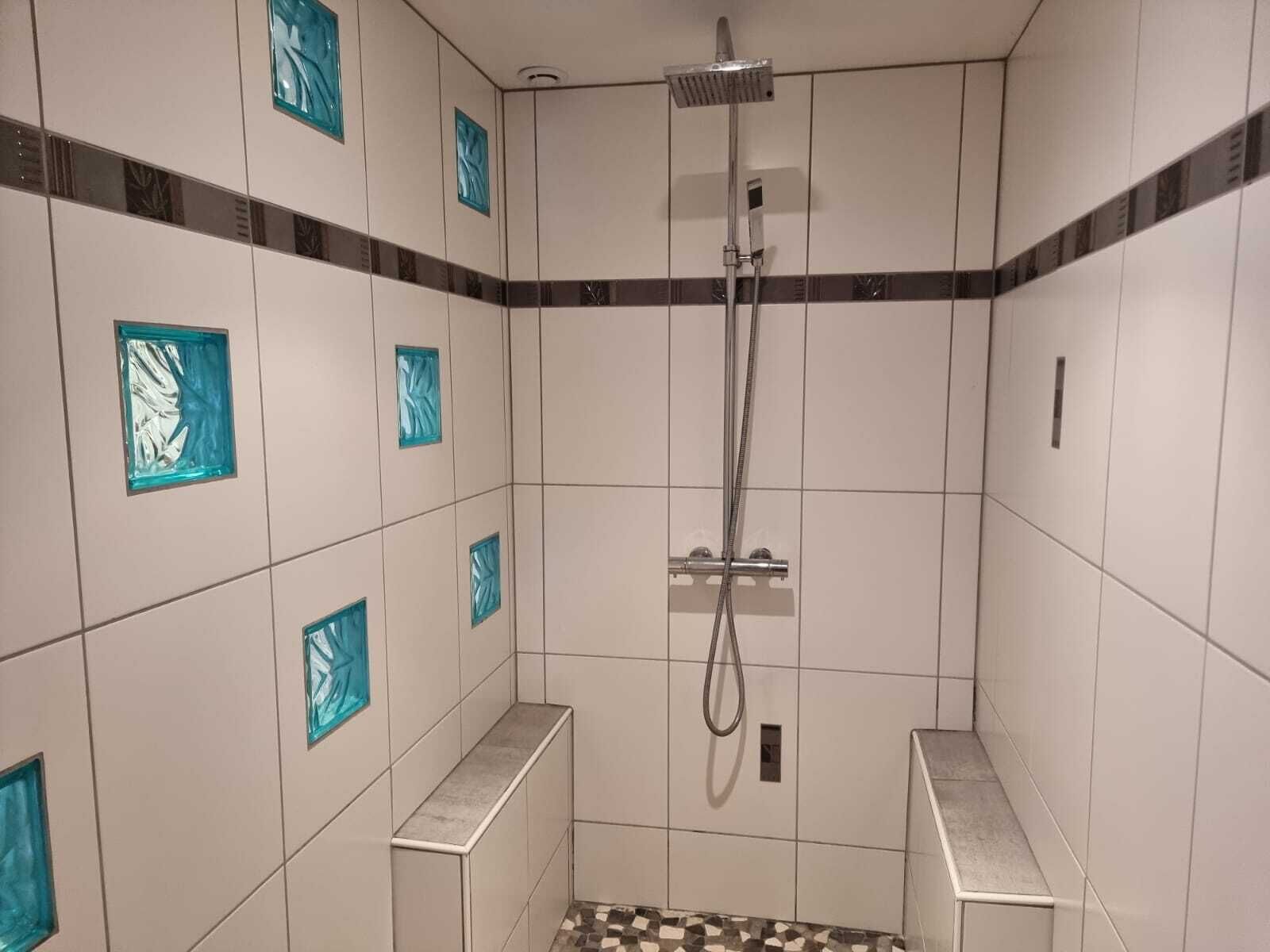 Shower, hair dryer, soap, toilet paper