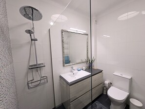 Shower, hair dryer, towels, soap