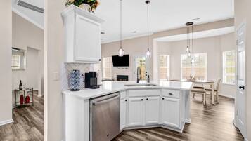 Coffee/tea maker, fridge, microwave, oven
