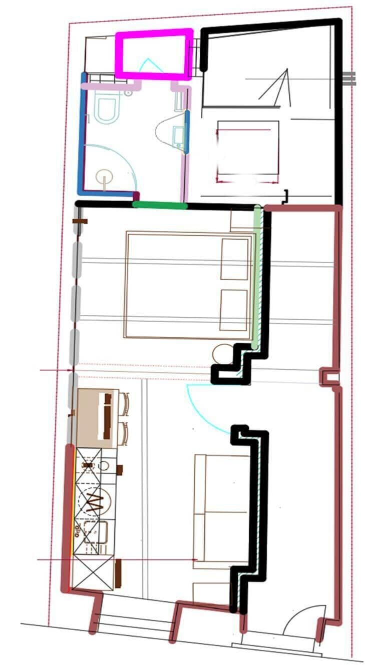 A floor plan with a kitchen, dining area, and a bathroom.