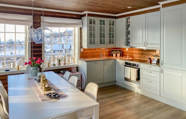 Fridge, dishwasher, coffee/tea maker, cookware/dishes/utensils