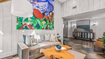 Smart TV, fireplace, books, computer monitors