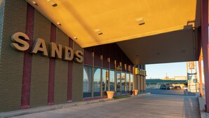 A hotel entrance with the name 'SANDS' prominently displayed.