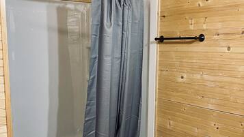 Shower, hair dryer, towels, toilet paper