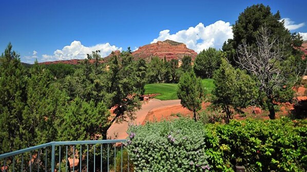Enjoy a serene view of the lush landscape and golf course from a viewing platform.