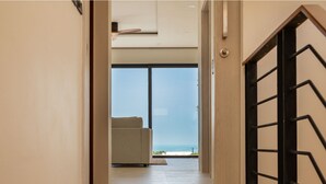 A modern interior with a view to the sea, a minimalist staircase, and a neutral color palette. - Villa Close to Fisherman Village - KBR15 (Koh Samui)