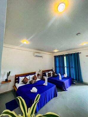 Deluxe Quadruple Room | Desk, iron/ironing board - Lily Resort Udawalawe (Udawalawa)