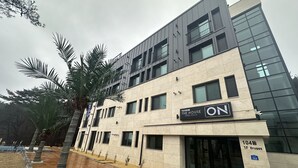 A modern building with a sign for "The House Pool Villa." - The on tourist hotel (Seosan)