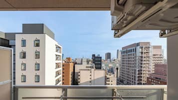 Suíte família | Espaço de trabalho para notebook, cortinas blackout
