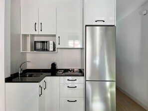 Fridge, microwave, coffee/tea maker, toaster