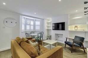 Basic Apartment | Living area | TV - Clapham Oasis: 1 Bedroom, Sauna, Garden Retreat (London)