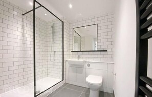 Shower, eco-friendly toiletries, hair dryer, towels
