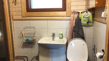 Een haardroger, een bidet, zeep