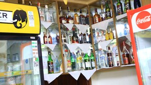 A liquor store with shelves stocked with various bottles of alcohol. - GLORY SUMMIT HOTEL  (Hoima)