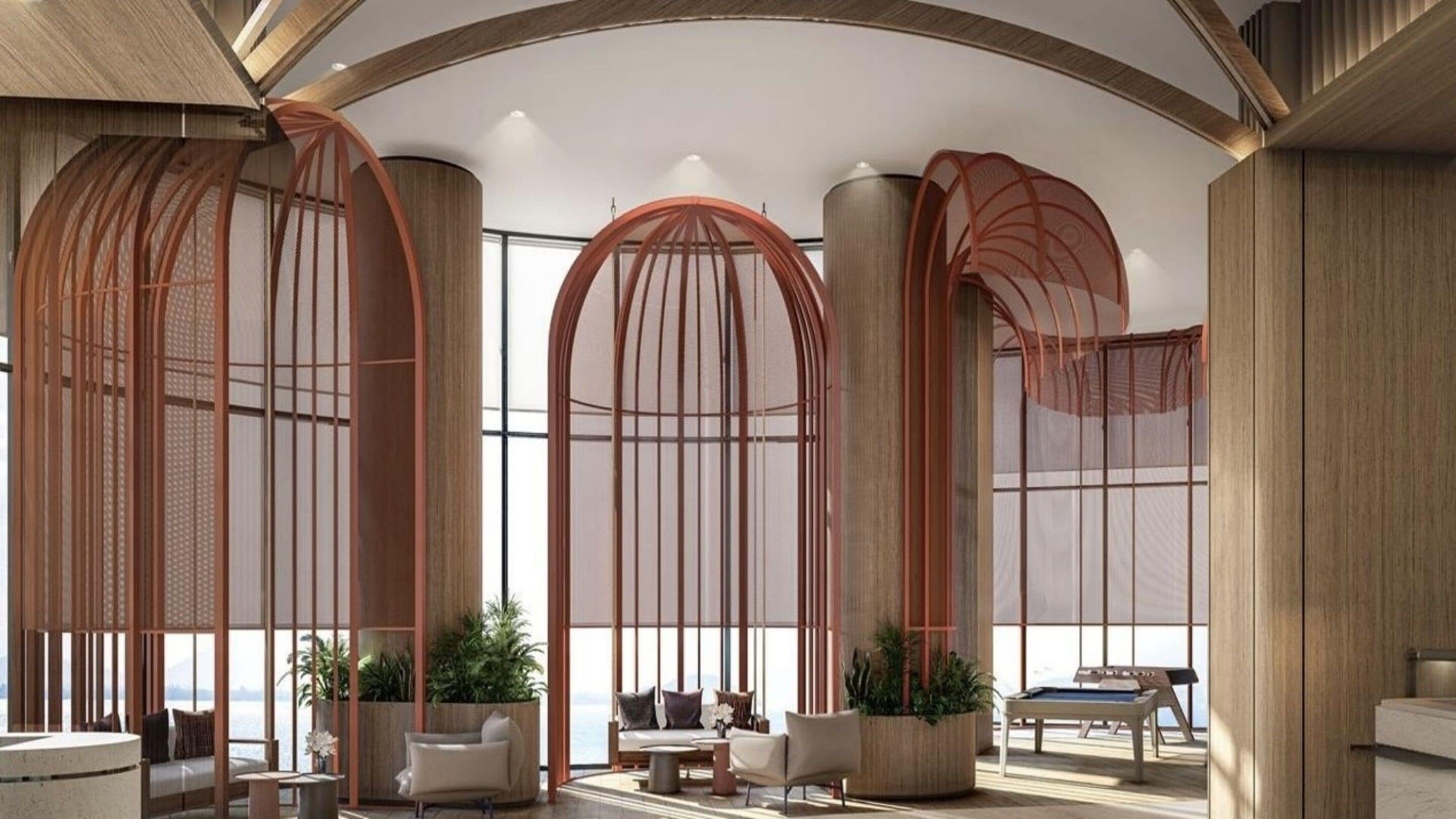 Un interior moderno con una zona de estar, ventanas amplias y vistas al exterior.