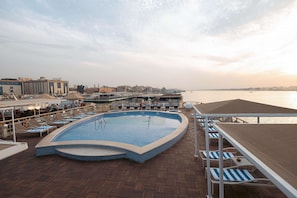 Outdoor pool, open 9:00 AM to 5:00 PM, sun loungers