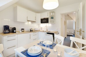 Fridge, microwave, dishwasher, coffee/tea maker