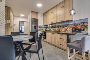 City Apartment | Living area | 37-inch flat-screen TV with digital channels