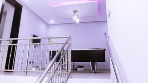 A modern interior with a staircase, a piano, and a ceiling with recessed lighting. - Stunning 3-bed House in Lagos (Lagos)