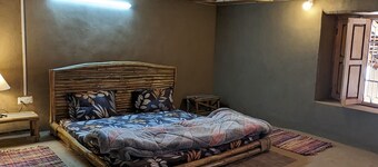 Mudhouse in tranquility and Dhauladhar's wondrous delight 