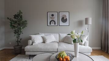 Spacious One-Bedroom (77kvm) | Living area | 60-inch flat-screen TV with cable channels