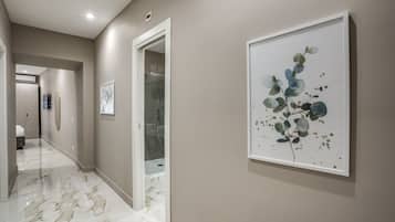 Deluxe Quadruple Room | Minibar, in-room safe, desk, blackout drapes