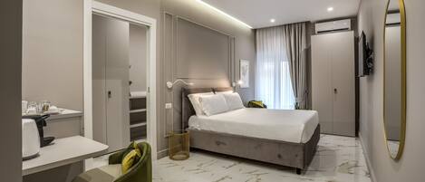 Deluxe Quadruple Room | 1 bedroom, minibar, in-room safe, desk
