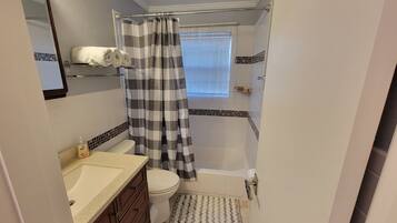 Hair dryer, towels, soap, shampoo