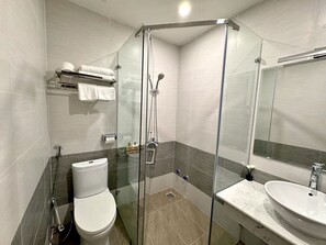 Shower, hair dryer, slippers, towels