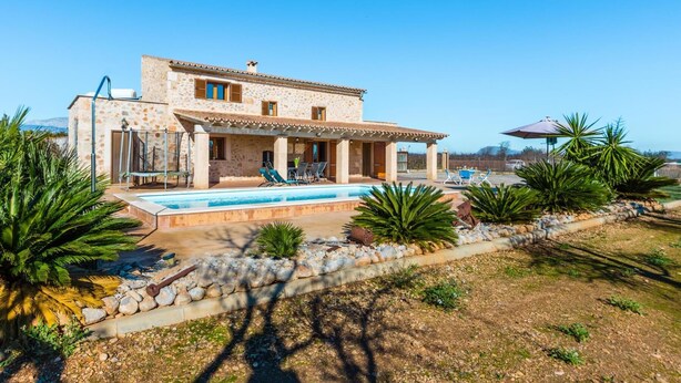 A two-story stone house with a swimming pool, outdoor seating, and a view of the sea. - H2923 Finca Capo with pool for 6 persons near Sa Pobla (Sa Pobla)