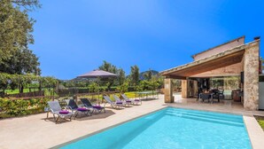 A swimming pool with lounge chairs and a covered patio area. - H2903 Finca Creveta for 5 persons with pool in Pollenca (Pollenca)