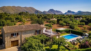 A stone villa with a tiled roof, a swimming pool, and a view of mountains. - H2904 Finca Creva with pool for 10 people in Pollenca (Pollenca)