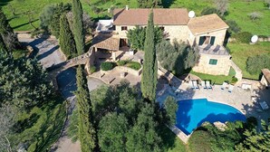 A large stone house with a swimming pool, surrounded by trees and a stone bridge. - H2910 Finca Bennassar Pollensa (Pollenca)