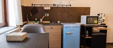 Fridge, microwave, stovetop, coffee/tea maker