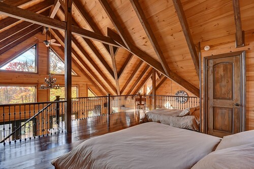 Luxurious chalet featuring a jacuzzi, pool, small lake, sauna and pool table.