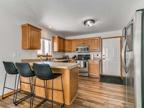 Fridge, coffee/tea maker, cookware/dishes/utensils