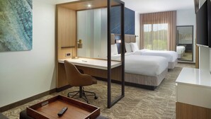 A hotel room with a desk, two beds, a chair, a TV, and a large window. - Springhill Suites By Marriott Ellijay (Ellijay)