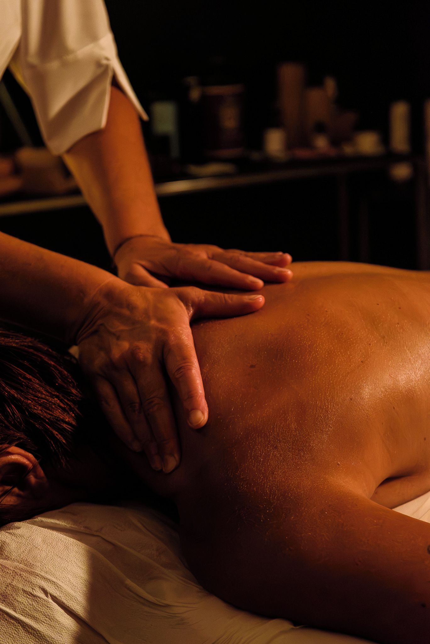 A person receiving a back massage.