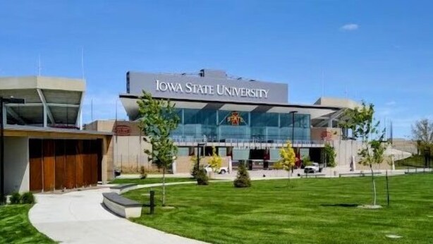 A modern building with the text "IOWA STATE UNIVERSITY" on the facade. - Cozy Nook Cottage With Hot Tub (Nevada)