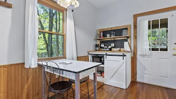 Fridge, microwave, coffee/tea maker, dining tables